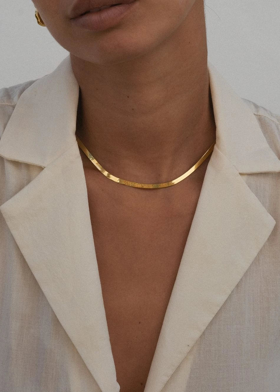 Cadena Zane en oro, puesta